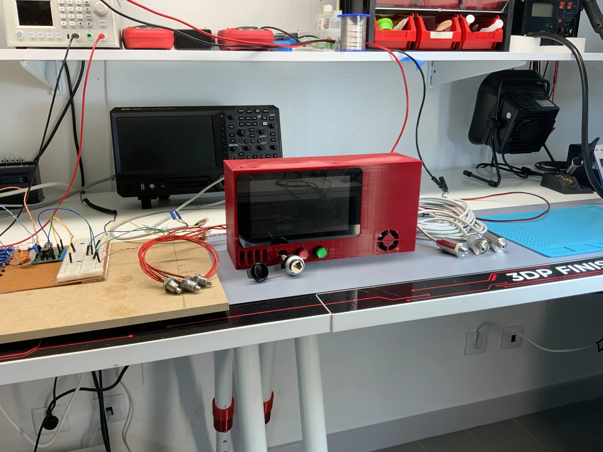 The 3D-printed enclosure on the test bench, pre-wiring.