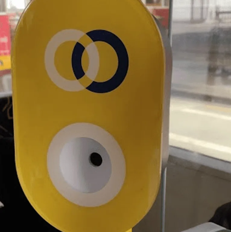 QRIS validator mounted on a Lisbon tram pole.