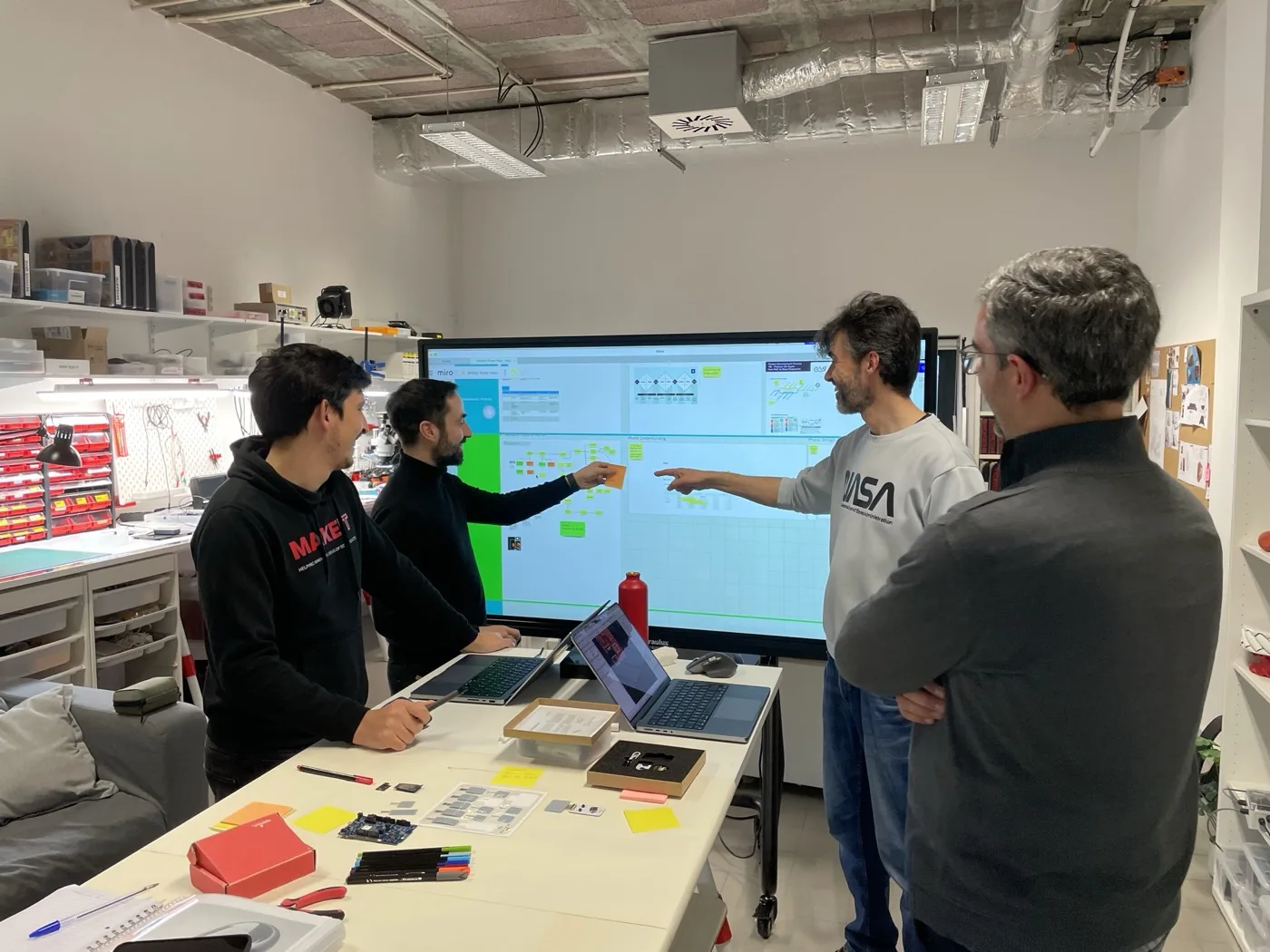 The MAKE IT team reviewing a project during a Power Hour session